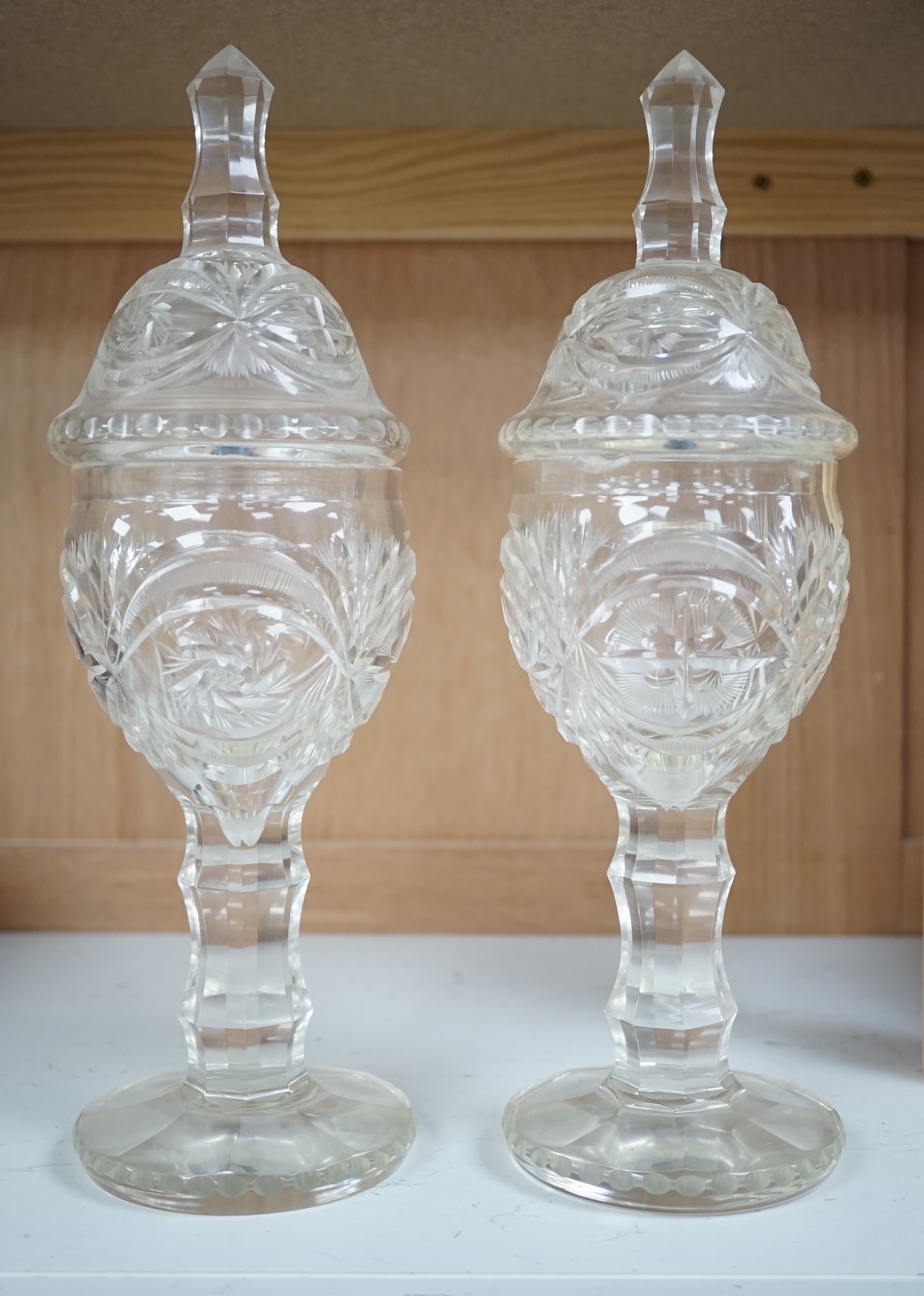 A pair of Bohemian glass sweetmeat vases and covers, 31cm. Condition - fair